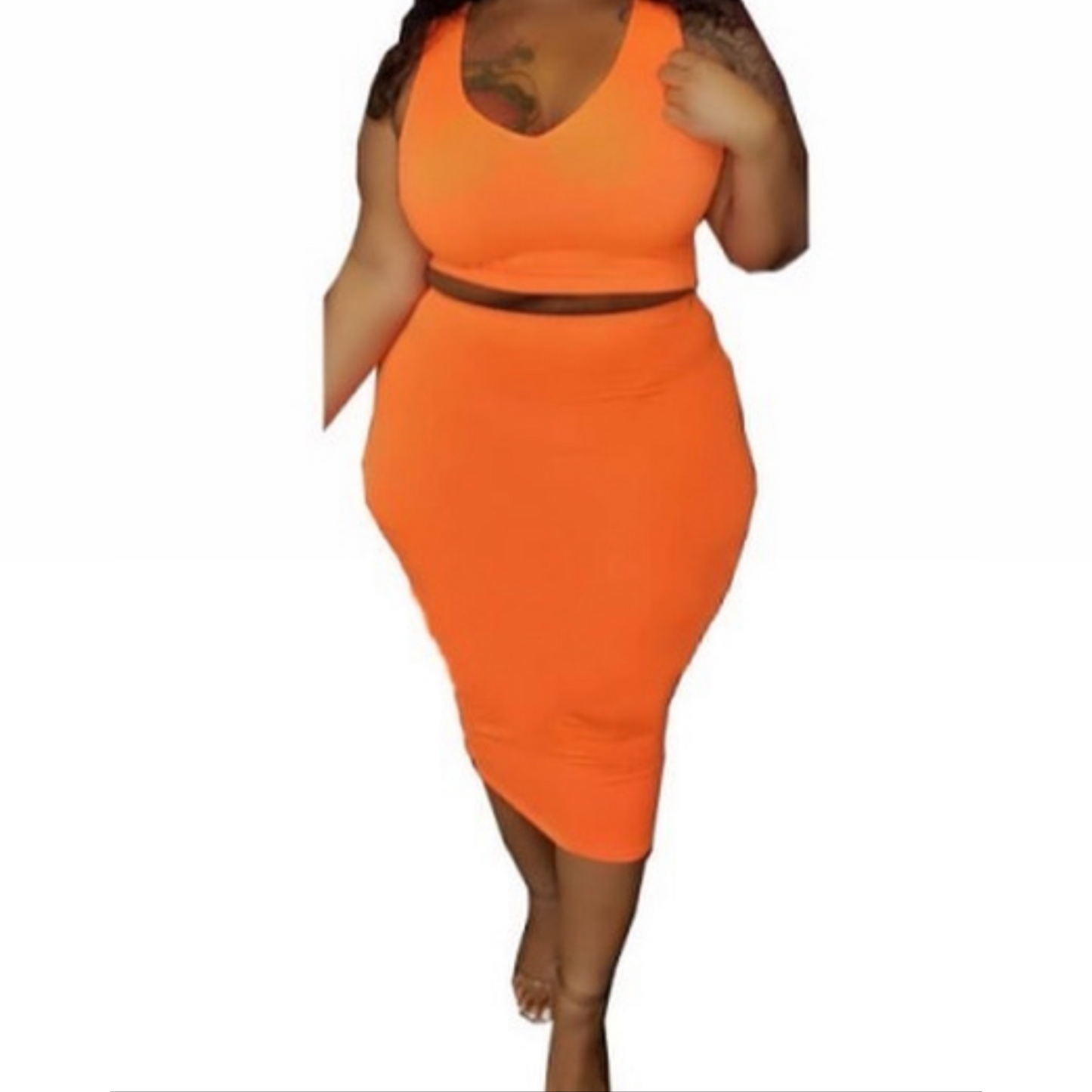 plus-size matching set includes a tank top crop and a mid-calf skirt with stretch