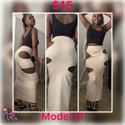 beige skirt features two peek-a-boo openings on either side, and its stretchy material