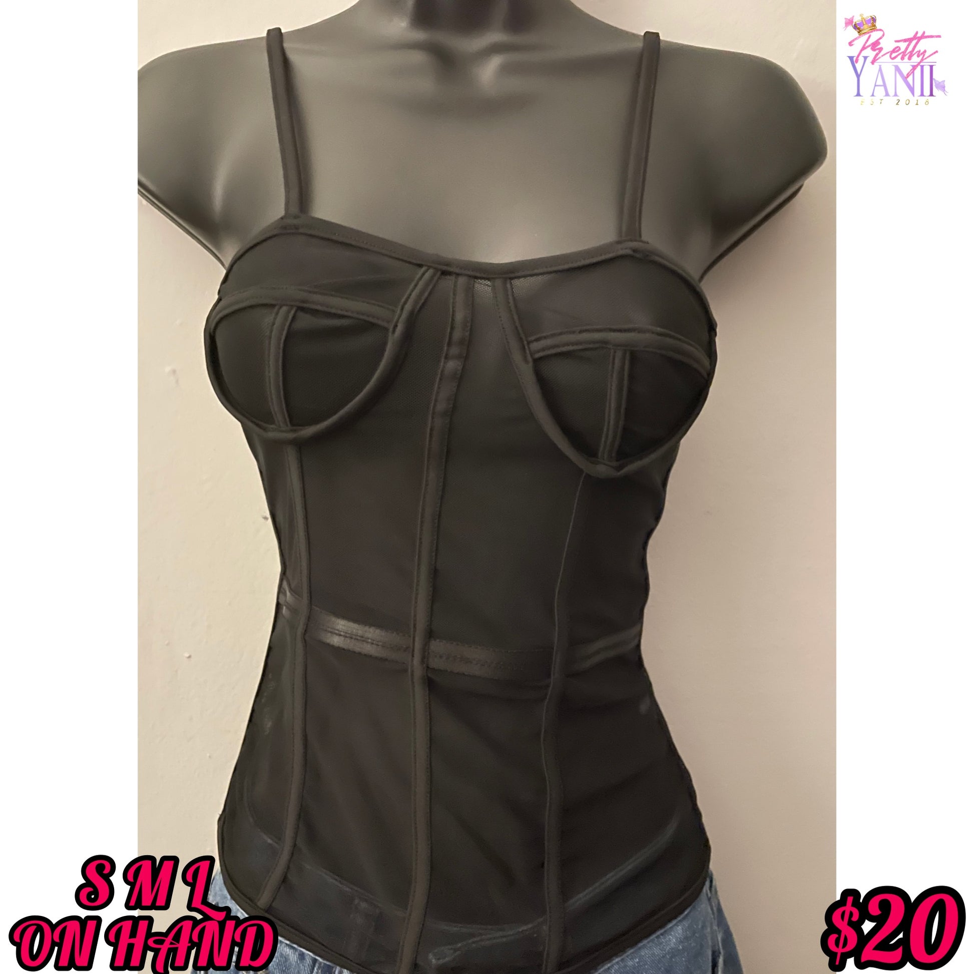 black bustier top features a stretchy see-through design