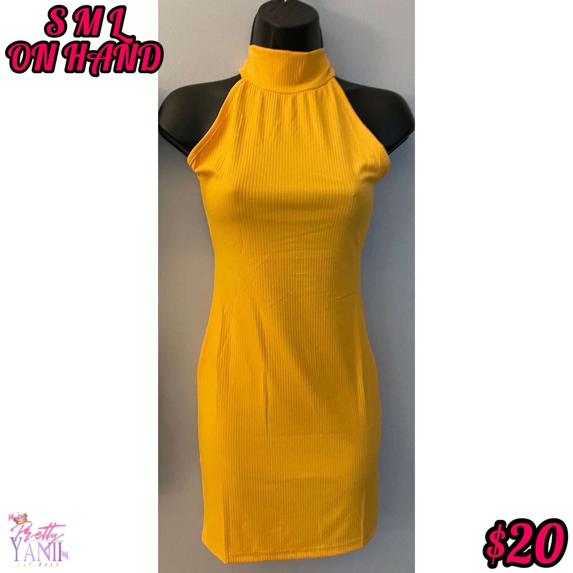 mustard-colored dress with a criss-cross back design and stretch fabric