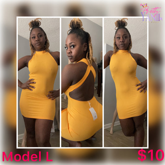 mustard-colored dress with a criss-cross back design and stretch fabric